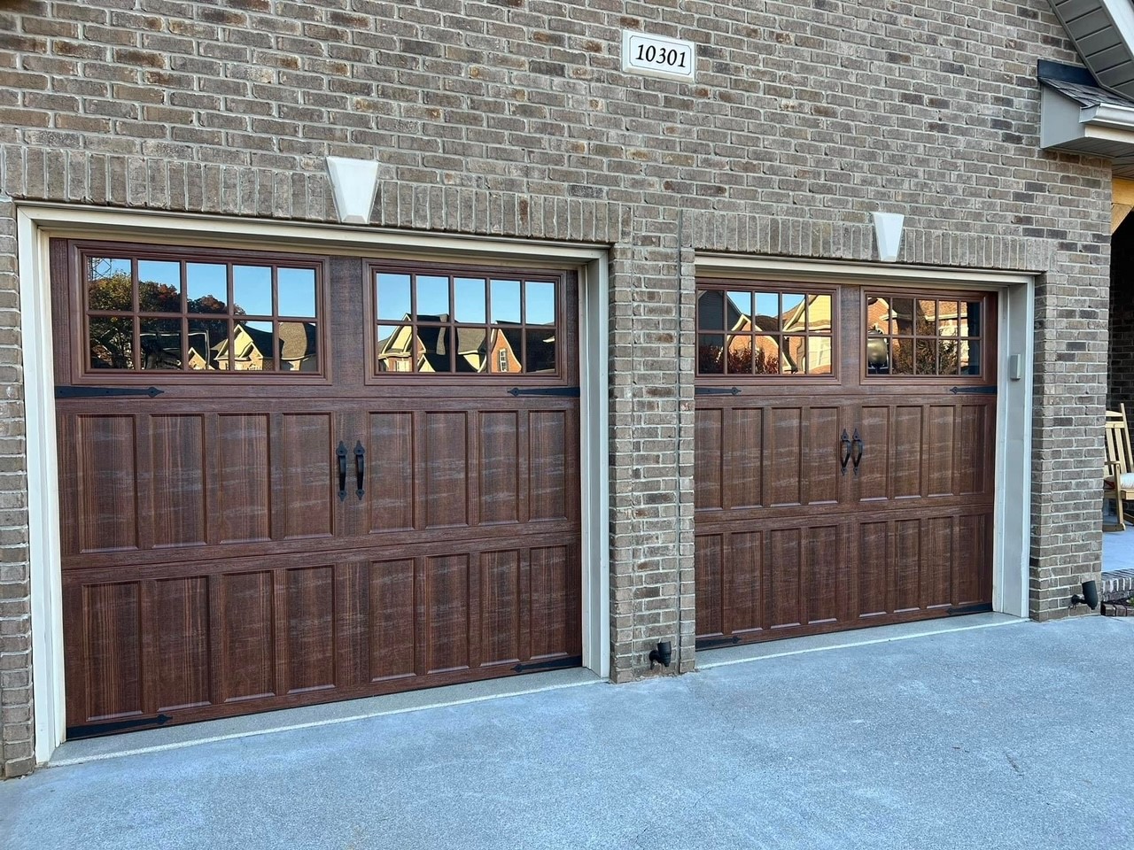 wooden garage doors with decorative hardware